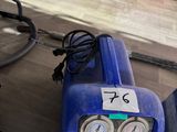 a blue machine that is sitting on a table