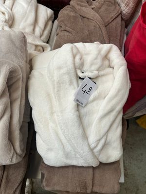 several towels are stacked on top of each other in a pile