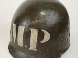 an old military helmet with the word m p painted on it