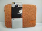 a picture of an orange laptop case with a note pad