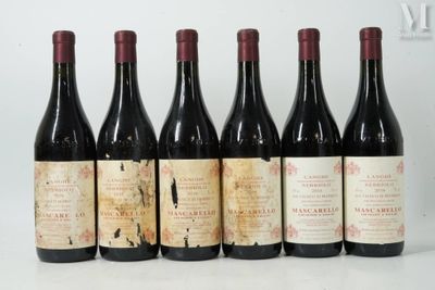six bottles of wine are lined up in a row on a table