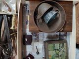 a wooden box filled with assorted items on a table