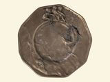 une image représentant une pièce de monnaie en bronze sur laquelle figure le visage d'une femme