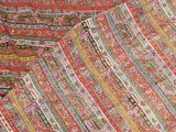 a close up of a multicolored cloth with a pattern on it