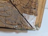 a close up of a piece of wood with a design on it