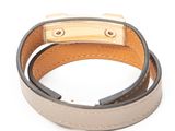 leather bracelet with a gold clasp on a white background
