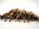 a pile of wood sticks sitting on a white surface