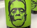 a bottle of beer with a picture of a man on it