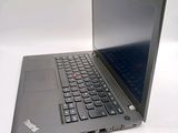 a laptop that is sitting on a white surface
