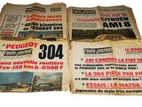 several newspapers are stacked on top of each other on a white surface