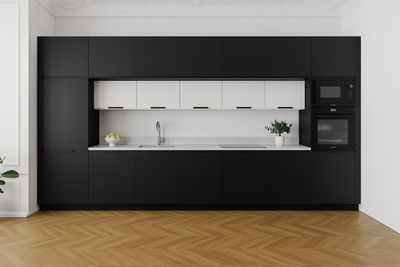 black and white kitchen with wooden floors and white cabinets