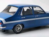 a blue toy car that is sitting on a white surface