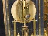 a clock that is inside of a glass case