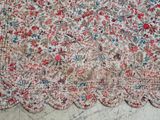 an image of a rug with a flowered design on it