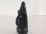 an image of a black sculpture of a man ' s face