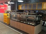 an image of a store with a counter and a display case