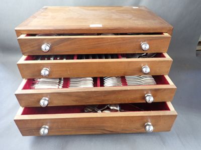a wooden box with silverware in it on a table