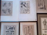 six framed drawings of various types of tools on a wooden floor