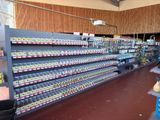 many shelves in the store that have various items on them