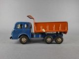 a toy truck that is sitting on a gray surface