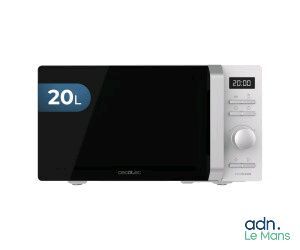 a white microwave oven with a digital clock on it