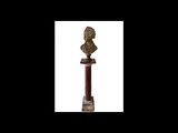 an image of a statue of a woman on a pedestal