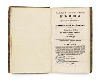 an open book with a stamp on the cover of it