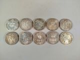 a close up of a bunch of coins sitting on top of a table