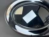 a silver plate with a mirror on it on a table