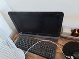 a laptop computer sitting on a desk with a mouse and keyboard