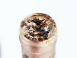 a close up of a bottle of wine with a cork stopper on it