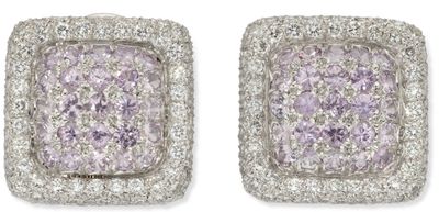 a pair of diamond and white gold earrings