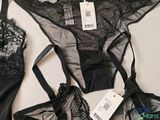 a black lingersuit with a black bralet and a black bralet
