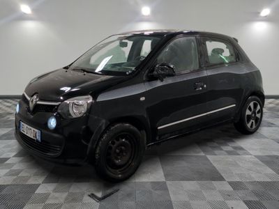 a picture of a small black car parked on a checkered floor