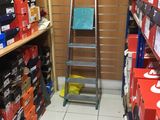 a ladder that is sitting in the middle of a store