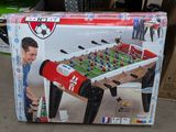 a box that has a foosball table inside of it