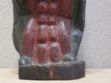 statue of a man with a beard and a hat on a table