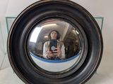 a woman taking a picture of herself in a mirror