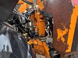 a close up of the front end of an orange tractor