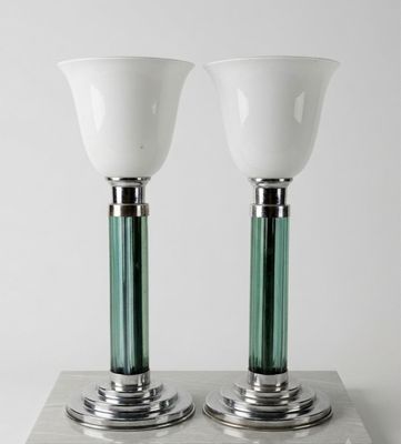 pair of green and white glass table lamps on a silver base