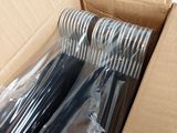 a cardboard box that has a bunch of knives in it
