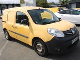 a yellow van that is parked in a parking lot