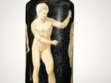 black and white vase with a nude man holding a stick