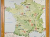 map of france in a wooden frame on a wall