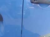 a close up of a door handle on a blue car