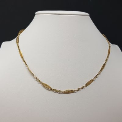 a gold chain necklace on a mannequin mannequin mannequin mannequin mannequin mannequin mannequin mannequin manne