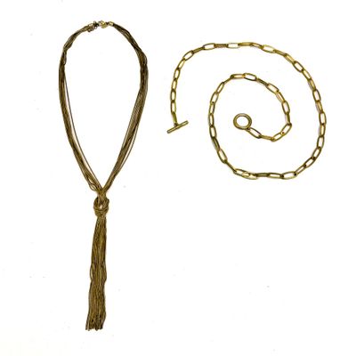 Deux colliers en métal doré signés au fermoir, l'un "Massimo…