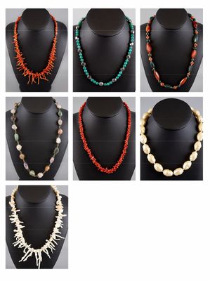 a set of six different necklaces with different colors and shapes