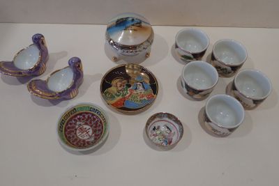 a lot of small bowls and cups on the table