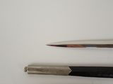 two different types of tools on a white surface